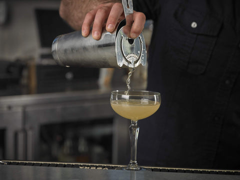 Barfly shaker held in hand demonstrating balanced weight and comfortable grip