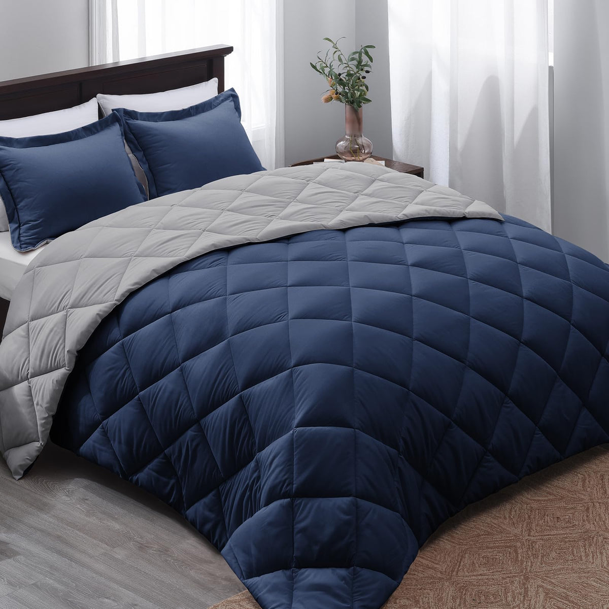 Basic Beyond comforter front view showing navy color and neat finish benefit