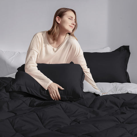 Basic Beyond comforter on queen bed showing scale, confirms generous drape and fit
