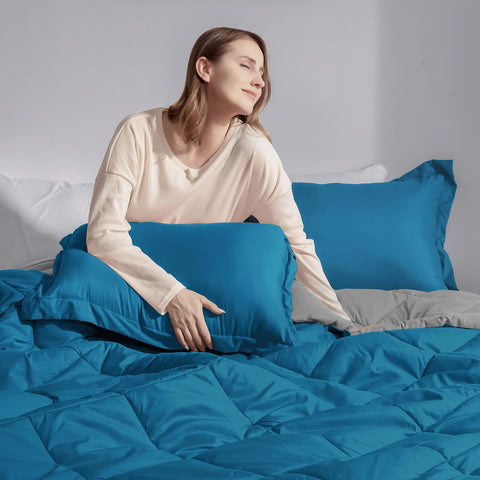 Basic Beyond comforter on queen bed showing scale and generous 88x92 inch coverage