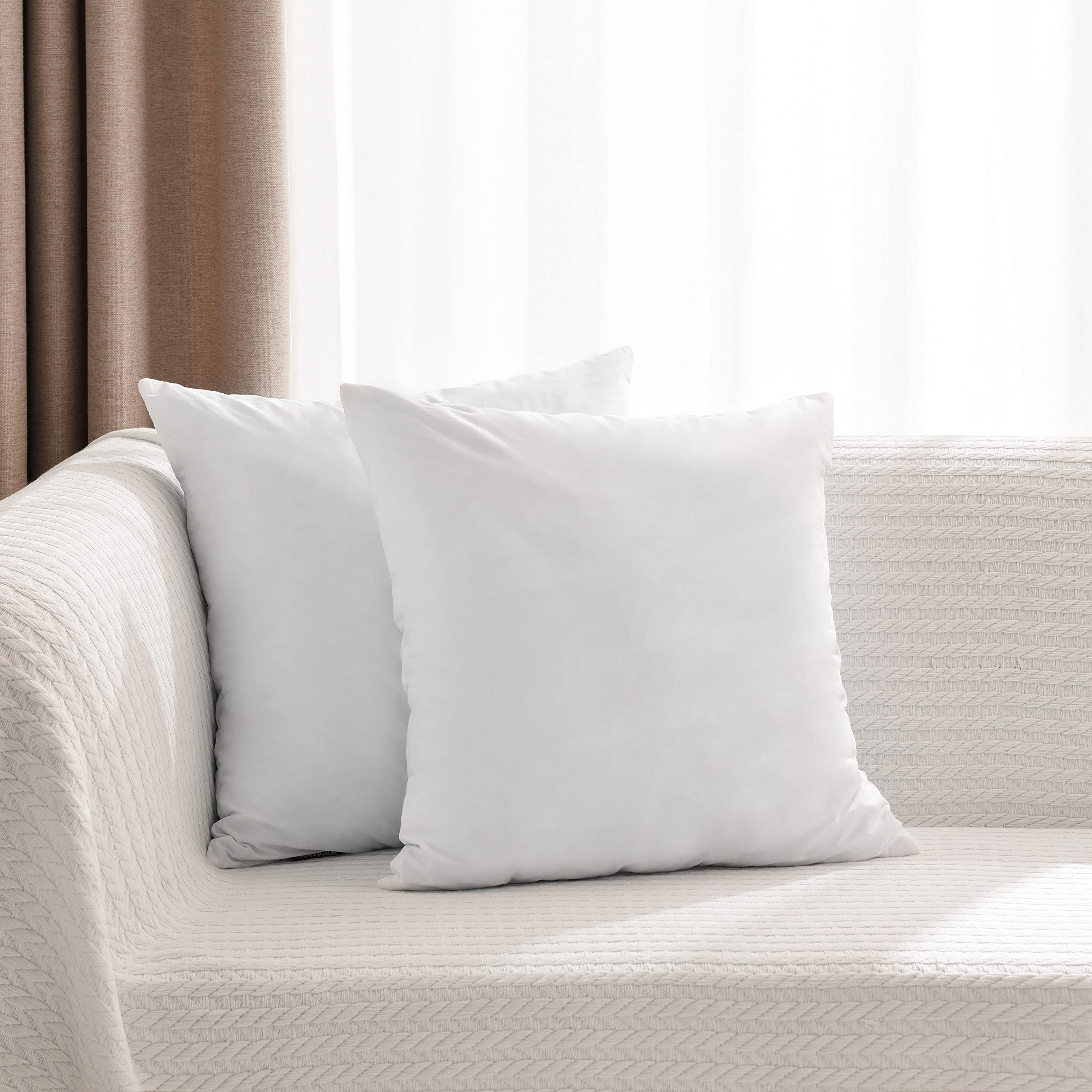basic home styled couch with pillows, hotel-style look and enhanced living room comfort