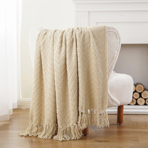 BATTILO HOME throw beside a book and mug to show scale and easy portability
