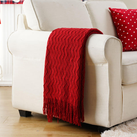 BATTILO HOME throw wrapped around person outdoors supplying cozy, travel-ready comfort