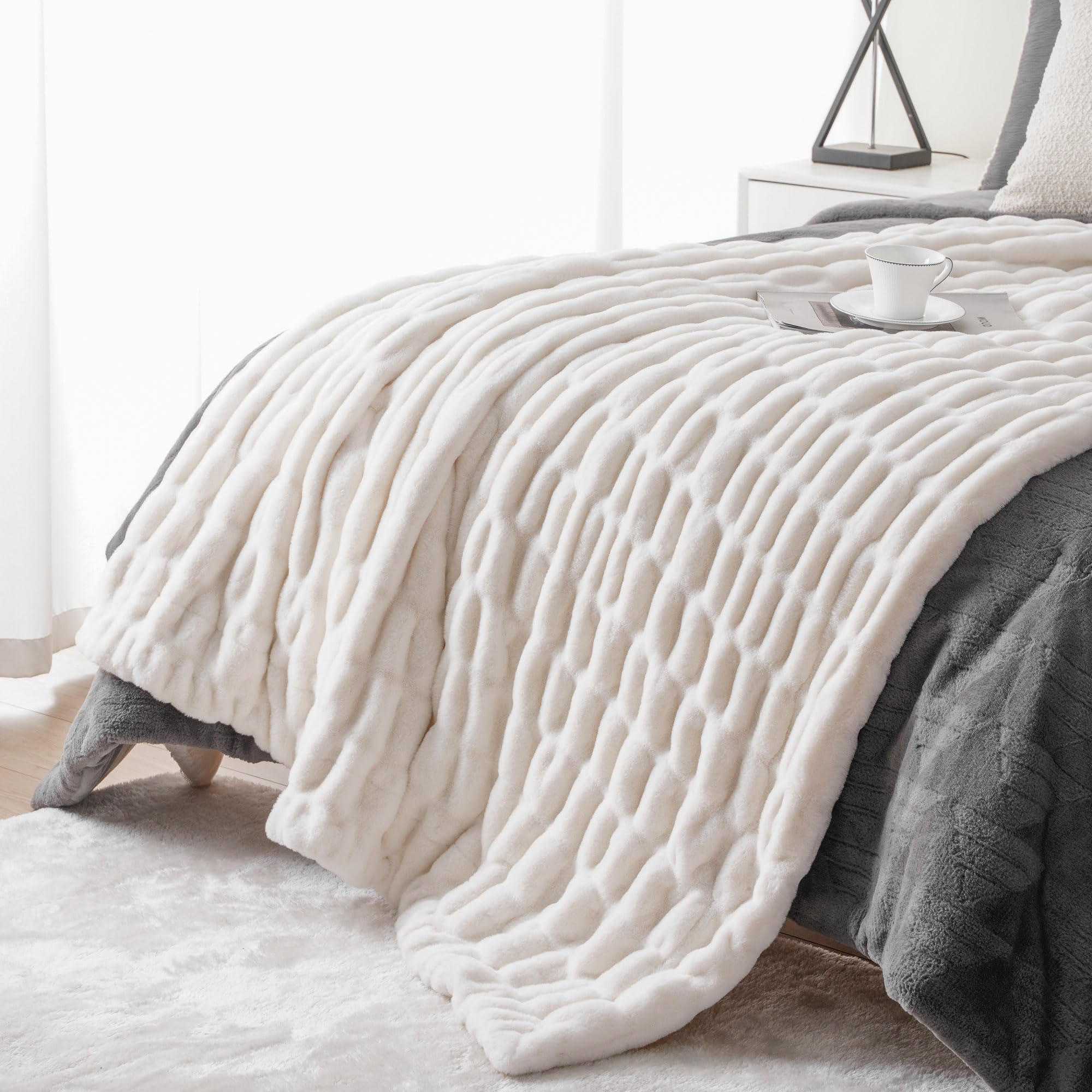 BATTILO HOME throw draped on couch adding warmth and stylish texture