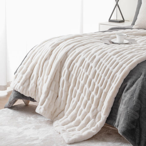 BATTILO HOME throw draped on couch adding warmth and stylish texture