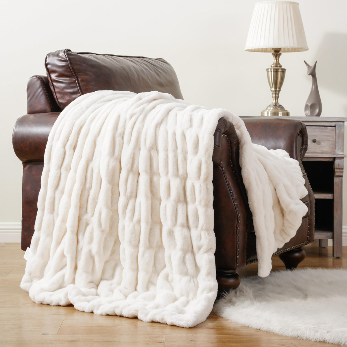 BATTILO HOME front view of ivory throw showing clean packaging and plush look