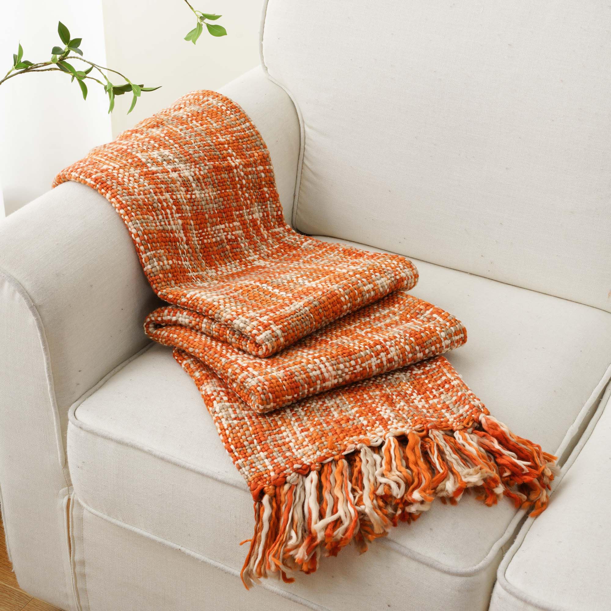 BATTILO HOME throw casually draped on sofa adding cozy living room accent
