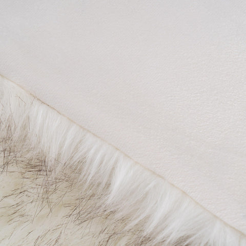 BATTILO HOME pet lounging on throw showing pet-friendly soft comfort benefit