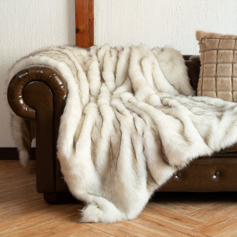 BATTILO HOME throw at bed foot demonstrating layered bedding warmth benefit