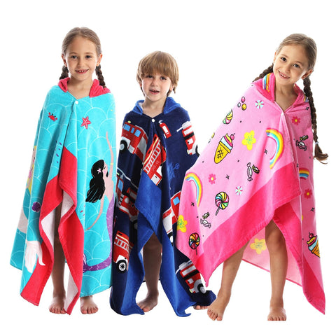 Bavilk child wearing poncho poolside for quick drying and warmth