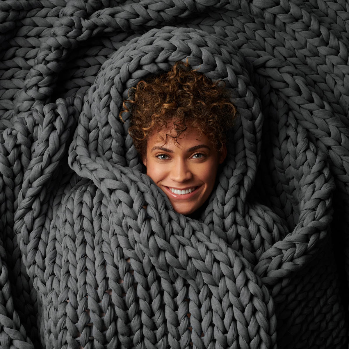 Bearaby Napper front view showing Asteroid Grey color and cozy appeal