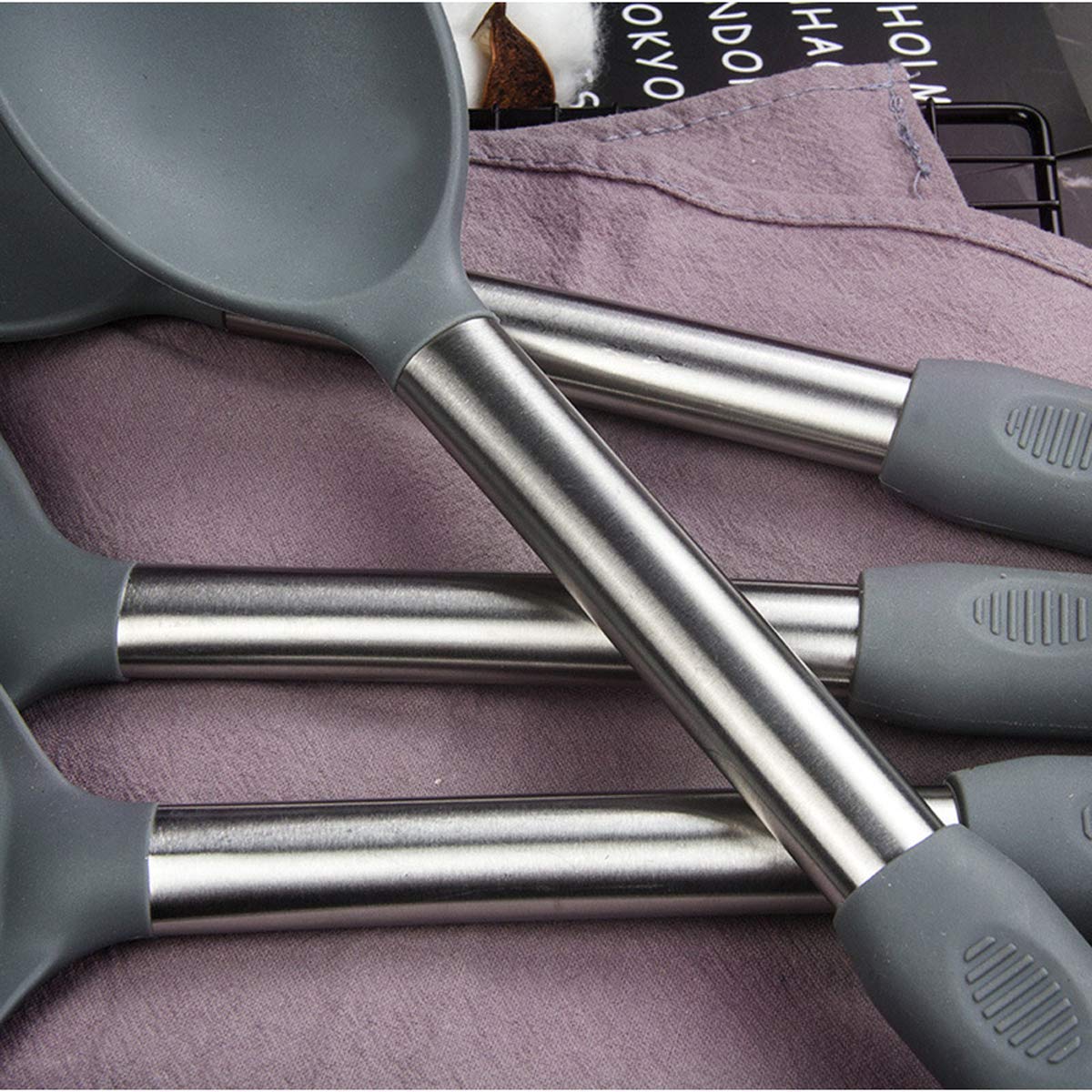 BECBOLDF utensils held in hand showing scaled size and ergonomic handling benefit