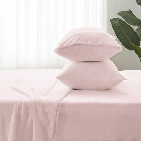 BEDELITE styled bedroom scene with pink sheets creating a cozy inviting atmosphere