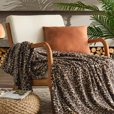 BEDELITE blanket draped over sofa adding pattern and protecting upholstery