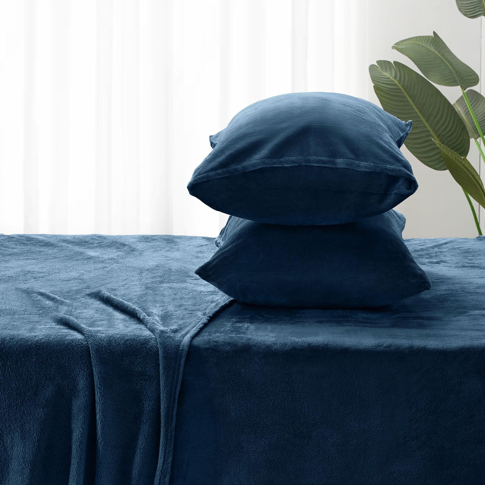 BEDELITE styled bedroom with navy sheets showing cozy, elegant atmosphere for bedroom updates