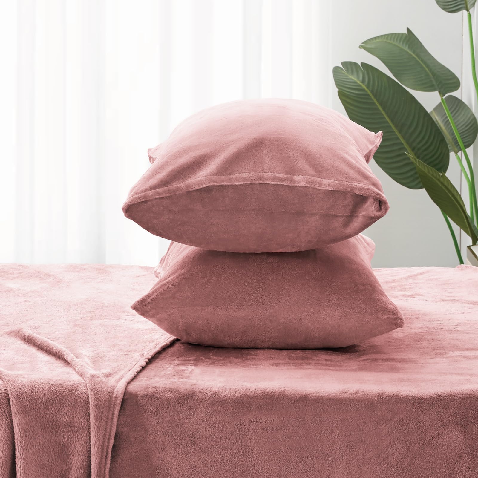 BEDELITE styled bedroom scene highlighting dusty pink sheets enhancing décor