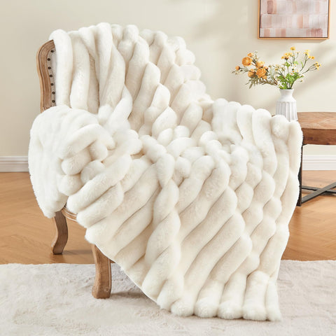 BEDELITE folded on couch showing cream color and cozy decor benefit