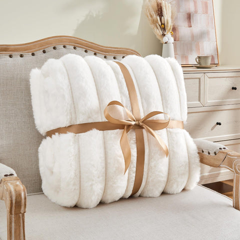BEDELITE draped on sofa lifestyle shot adding luxurious decor and warmth