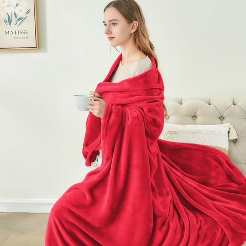 BEDELITE person wrapped in blanket reading for relaxing warmth