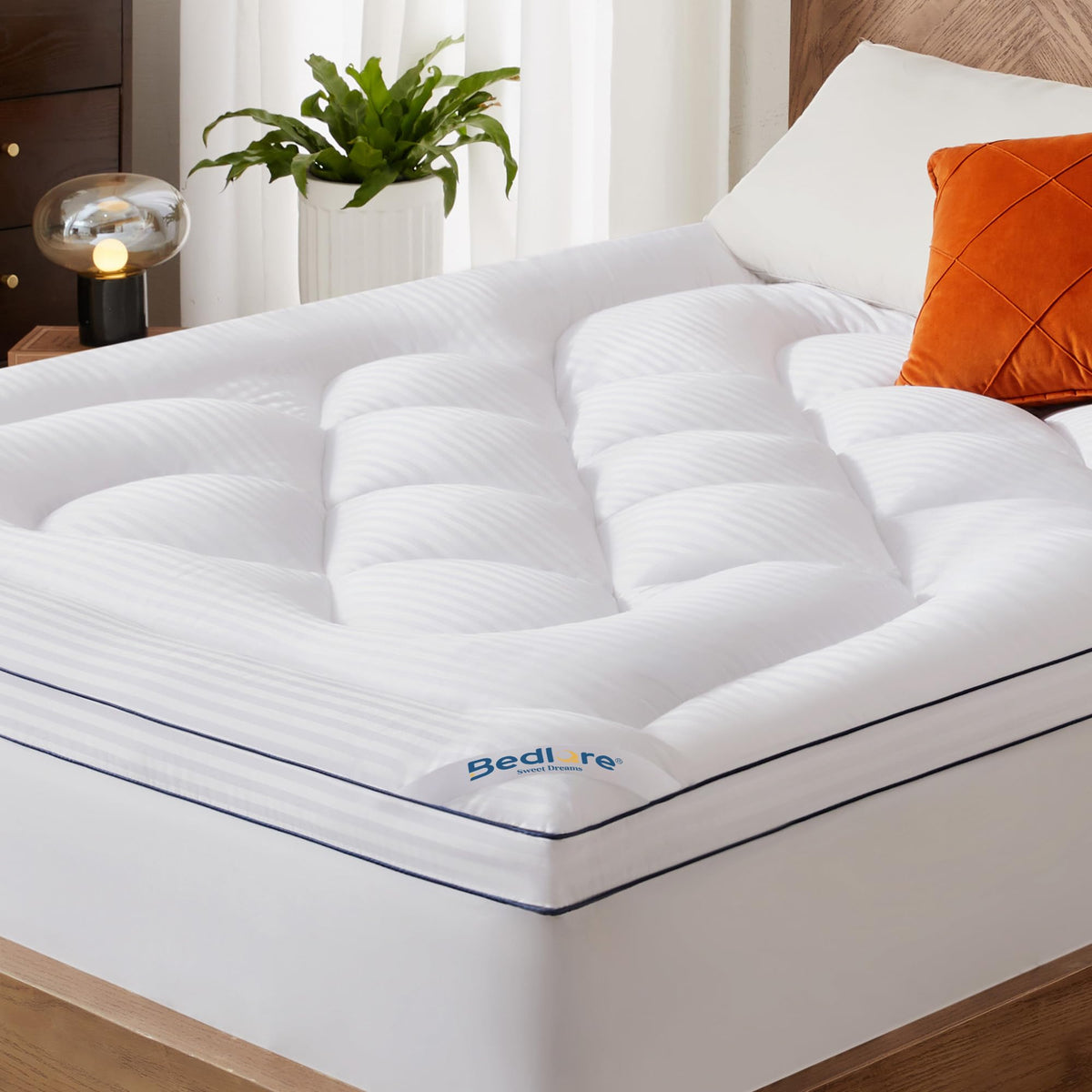 BEDLORE queen topper front view showing full coverage and neat fit, adds comfort