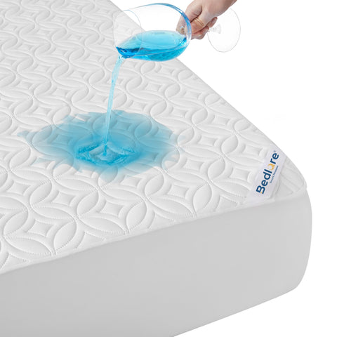 BEDLORE front view showing quilted full-size protector and neat fit