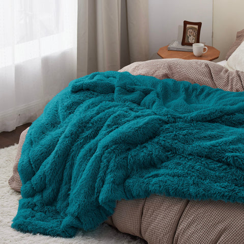 Bedsure blanket draped on bed adding teal decor and comfortable look