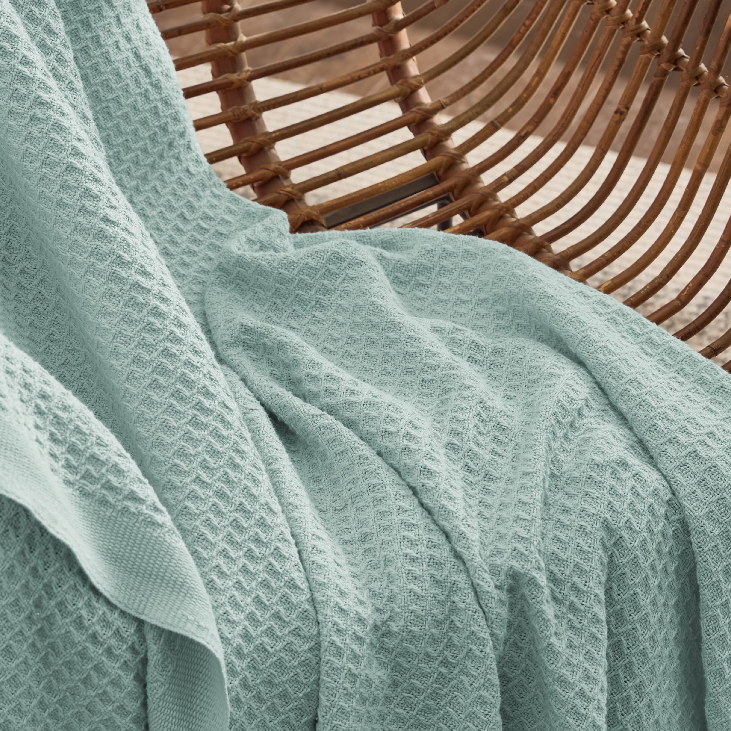 Bedsure blanket draped over queen bed adding layered warmth and style