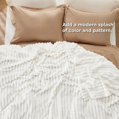 Bedsure blanket draped over sofa for lounging comfort and style
