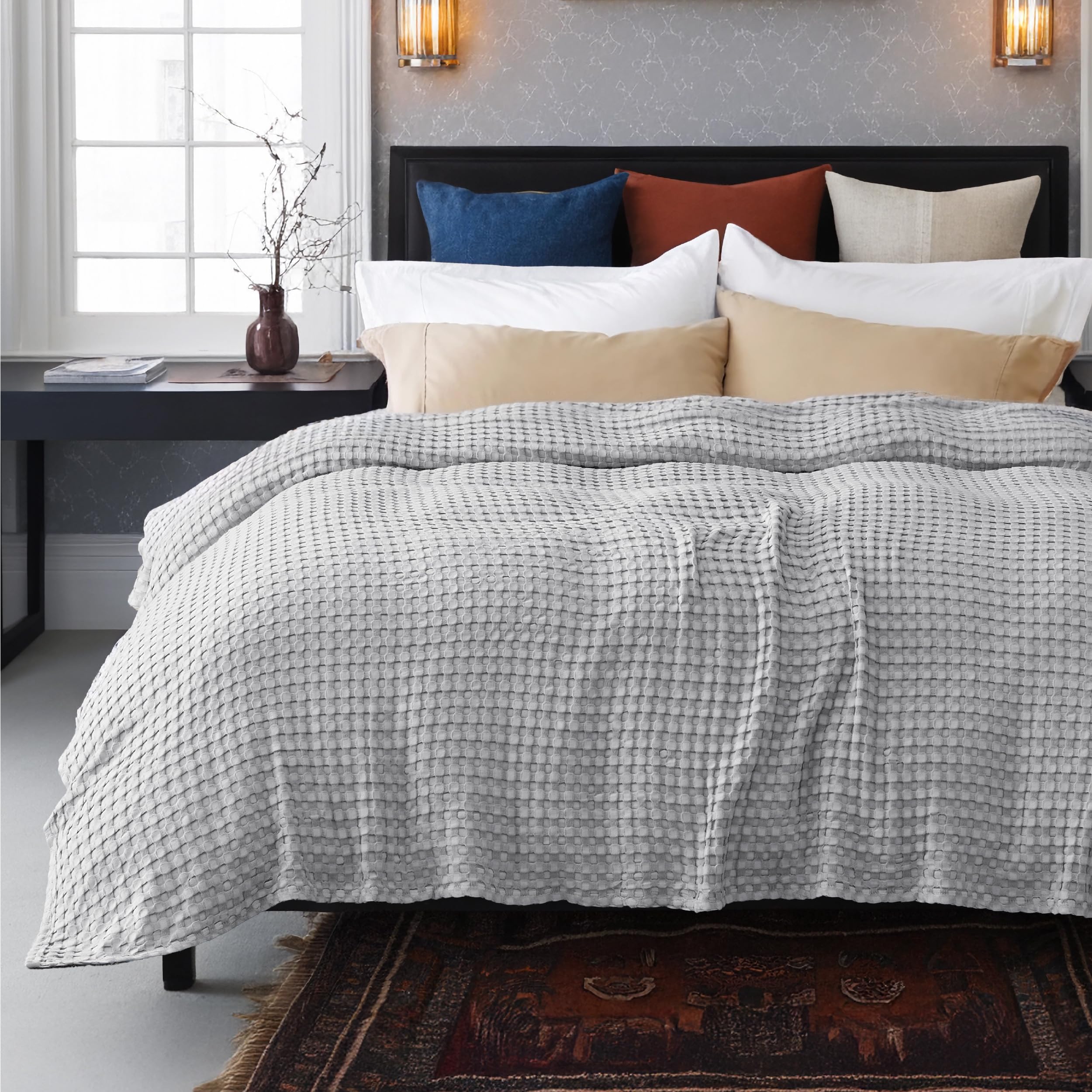Bedsure fabric held by hand demonstrating lightweight stretch and softness