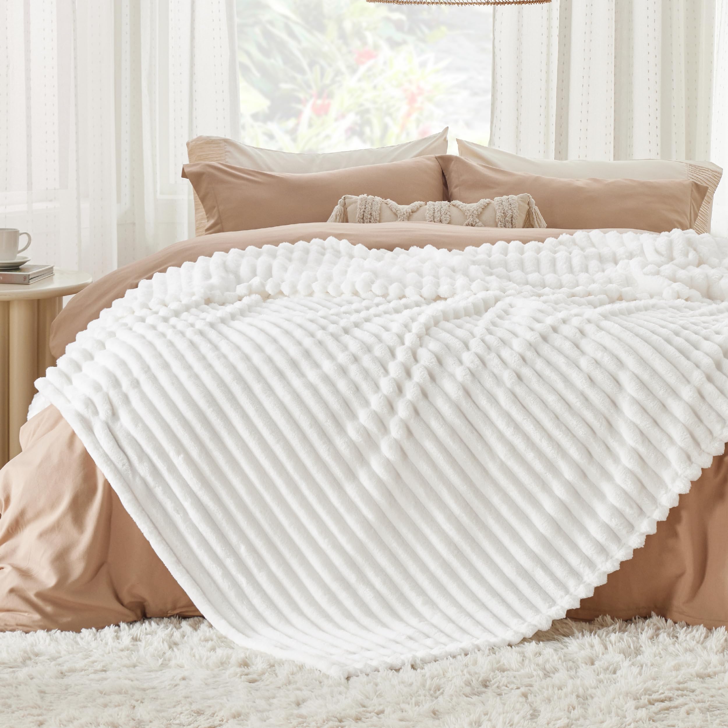 Bedsure folded blanket on shelf demonstrating neat storage and thickness