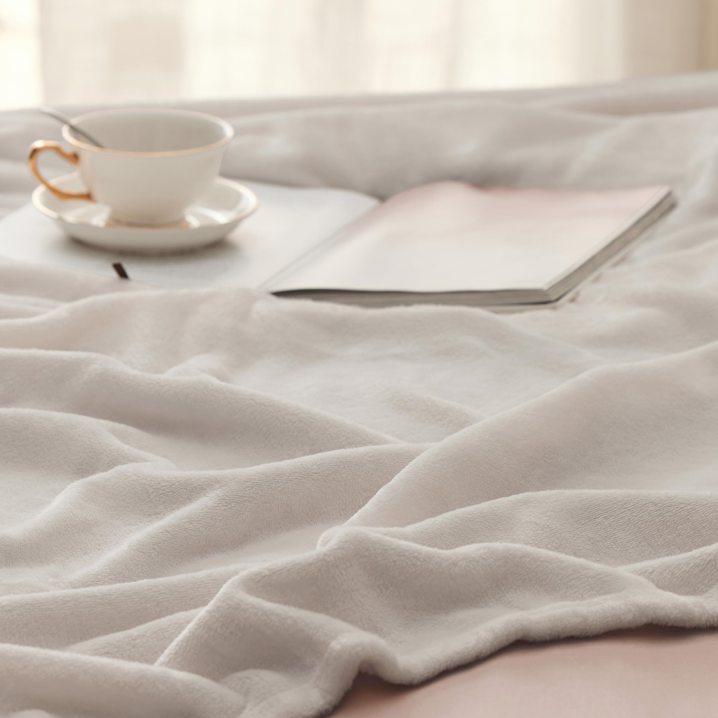 Bedsure blanket folded compact for travel showing easy portability