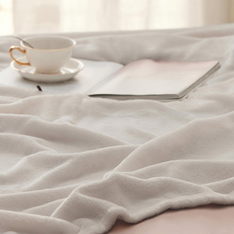 Bedsure blanket folded compact for travel showing easy portability