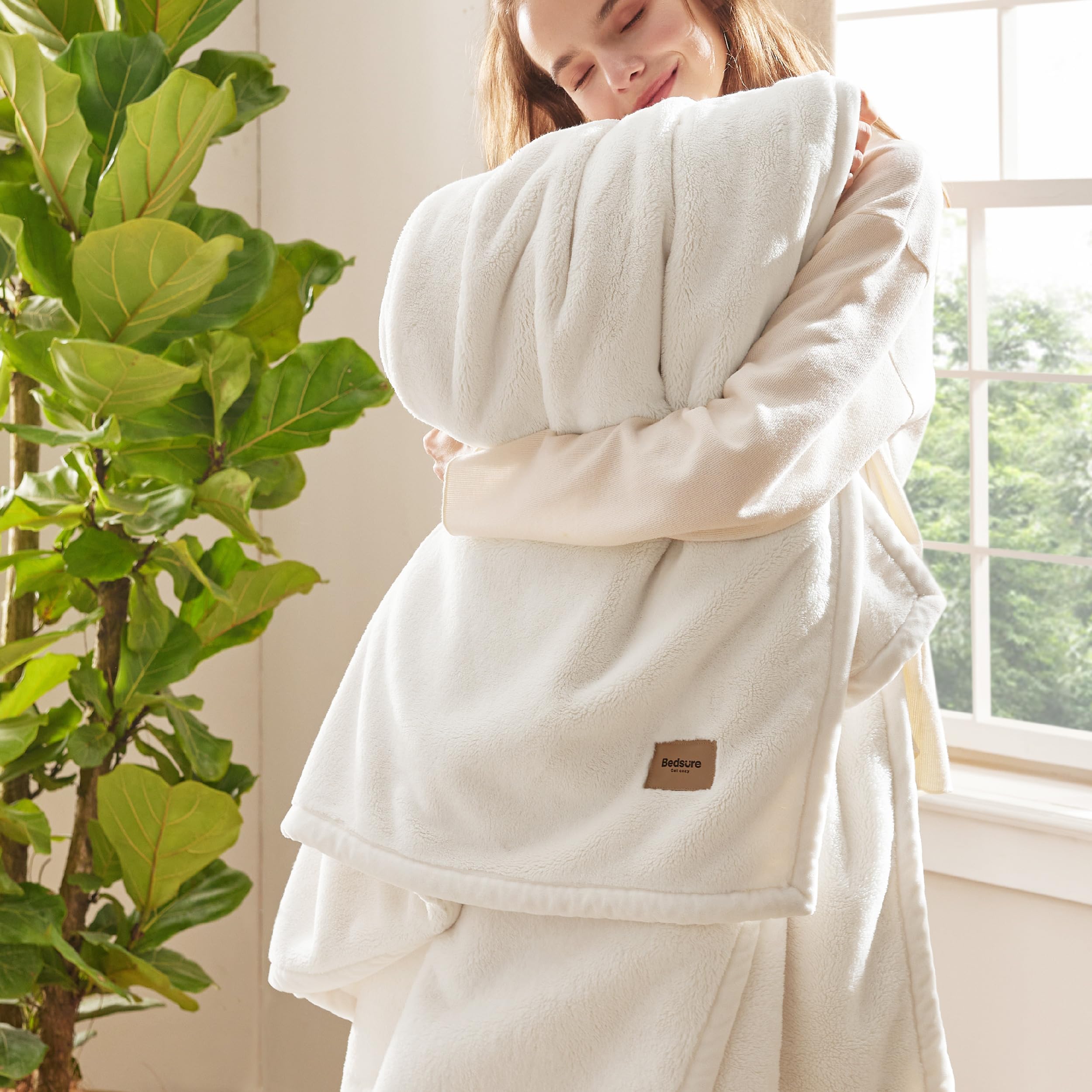 Bedsure blanket front folded in cream showing plush warmth