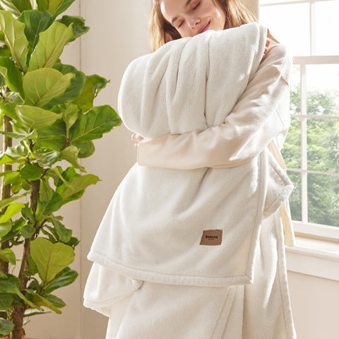 Bedsure blanket front folded in cream showing plush warmth