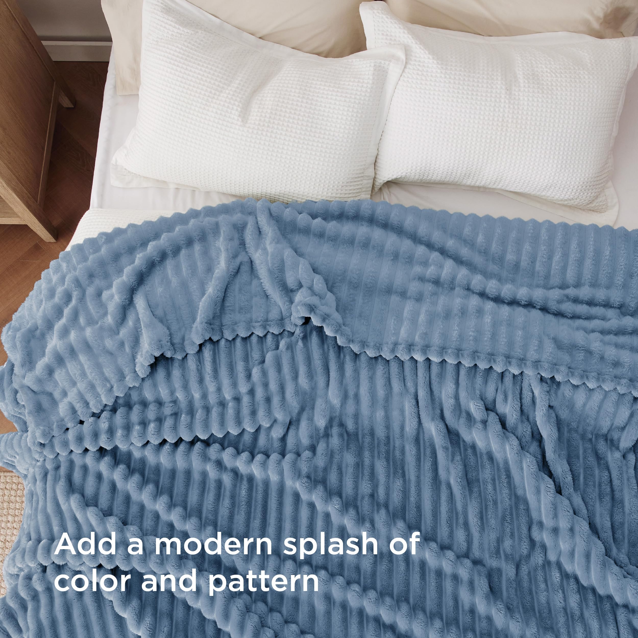 Bedsure blanket styled on a queen bed demonstrating generous 90x90 size