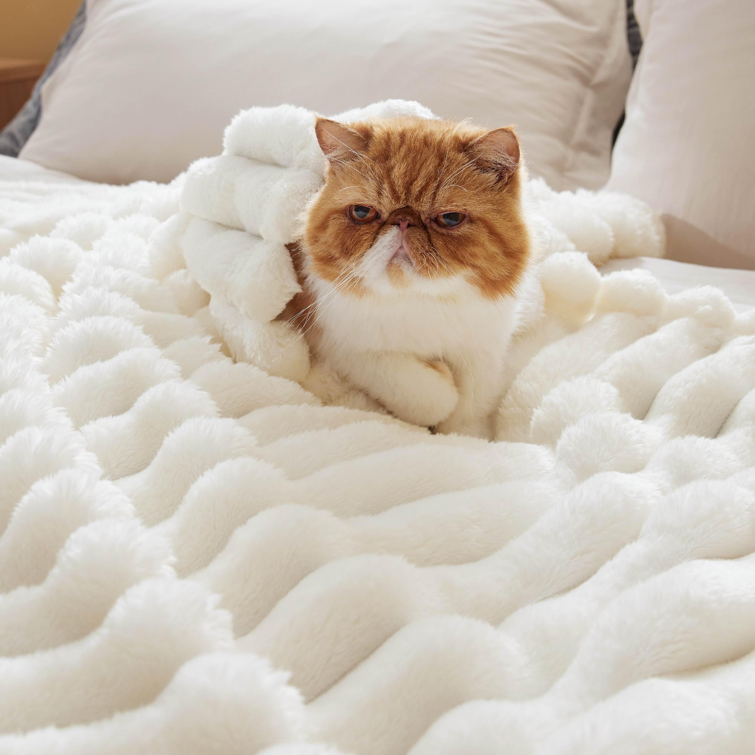 Bedsure blanket draped on a queen bed for generous coverage benefit