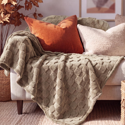 Bedsure blanket next to ruler showing 60x80 inches size for proper scale