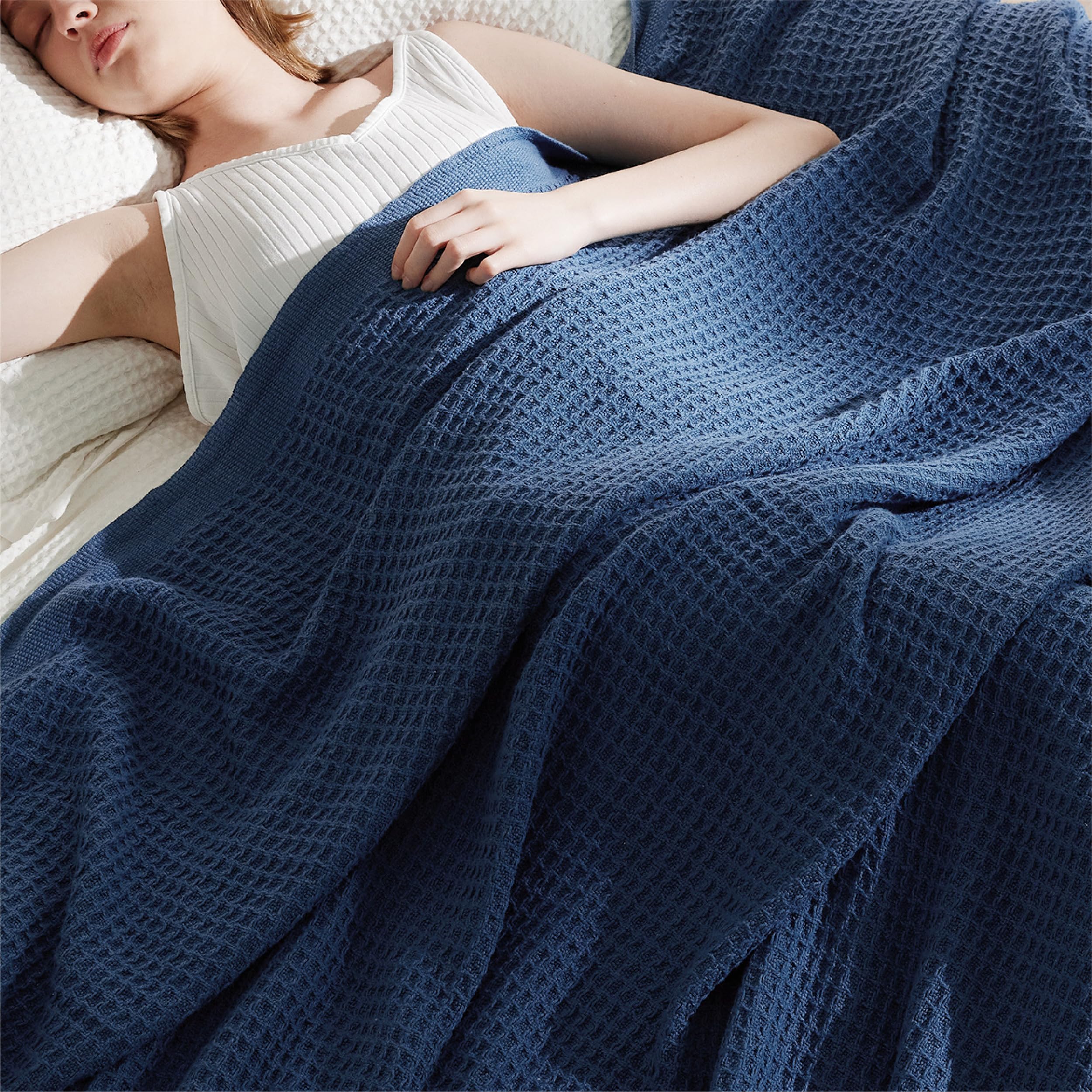 Bedsure blanket beside pillow showing 90x90 size and scale