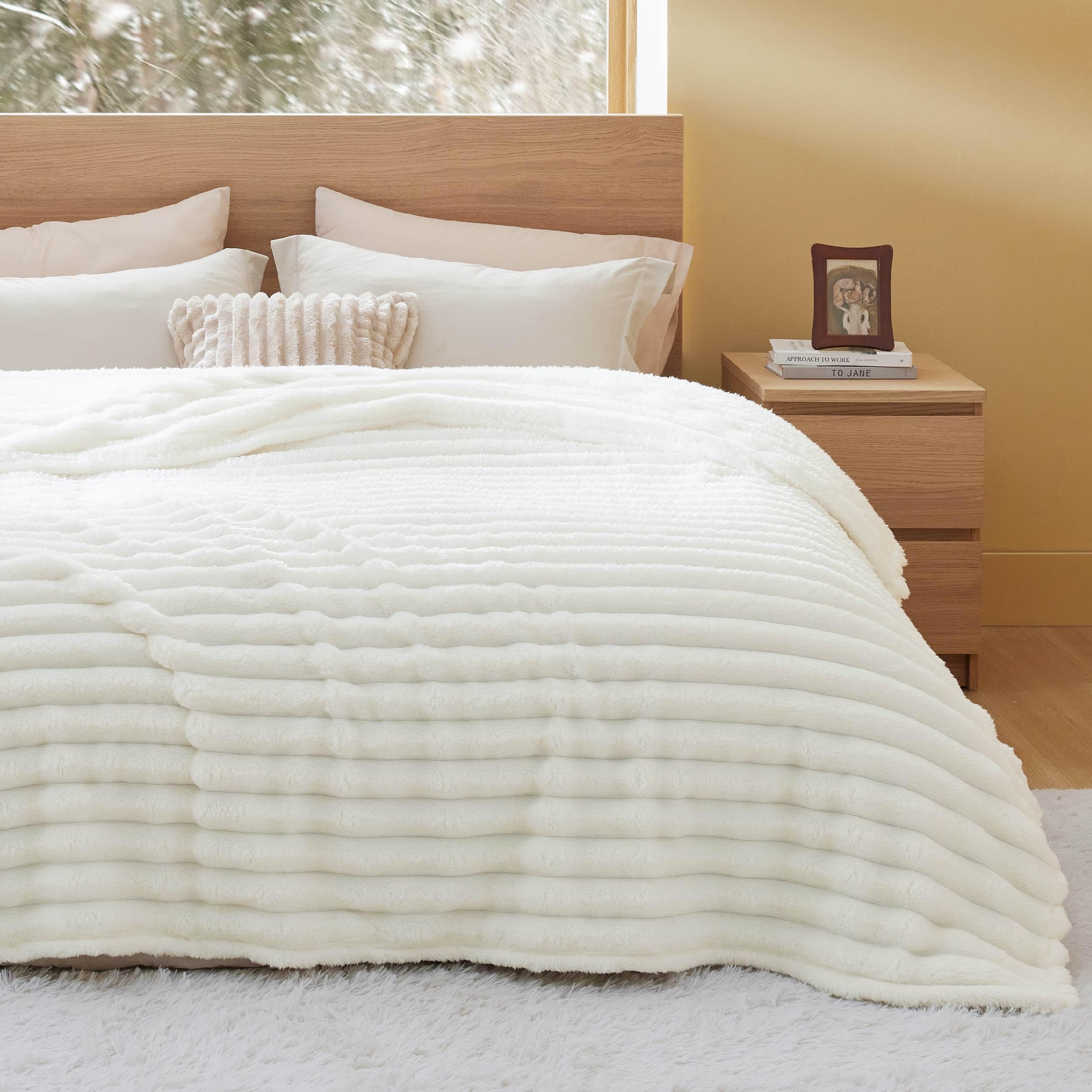 Bedsure blanket wrapped around a person offering warm travel comfort