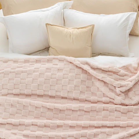 Bedsure styled in a dorm room on a chair to show student-friendly comfort and decor boost