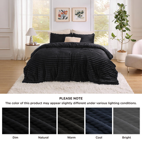 Bedsure hands compressing comforter to show loft and lightweight warmth