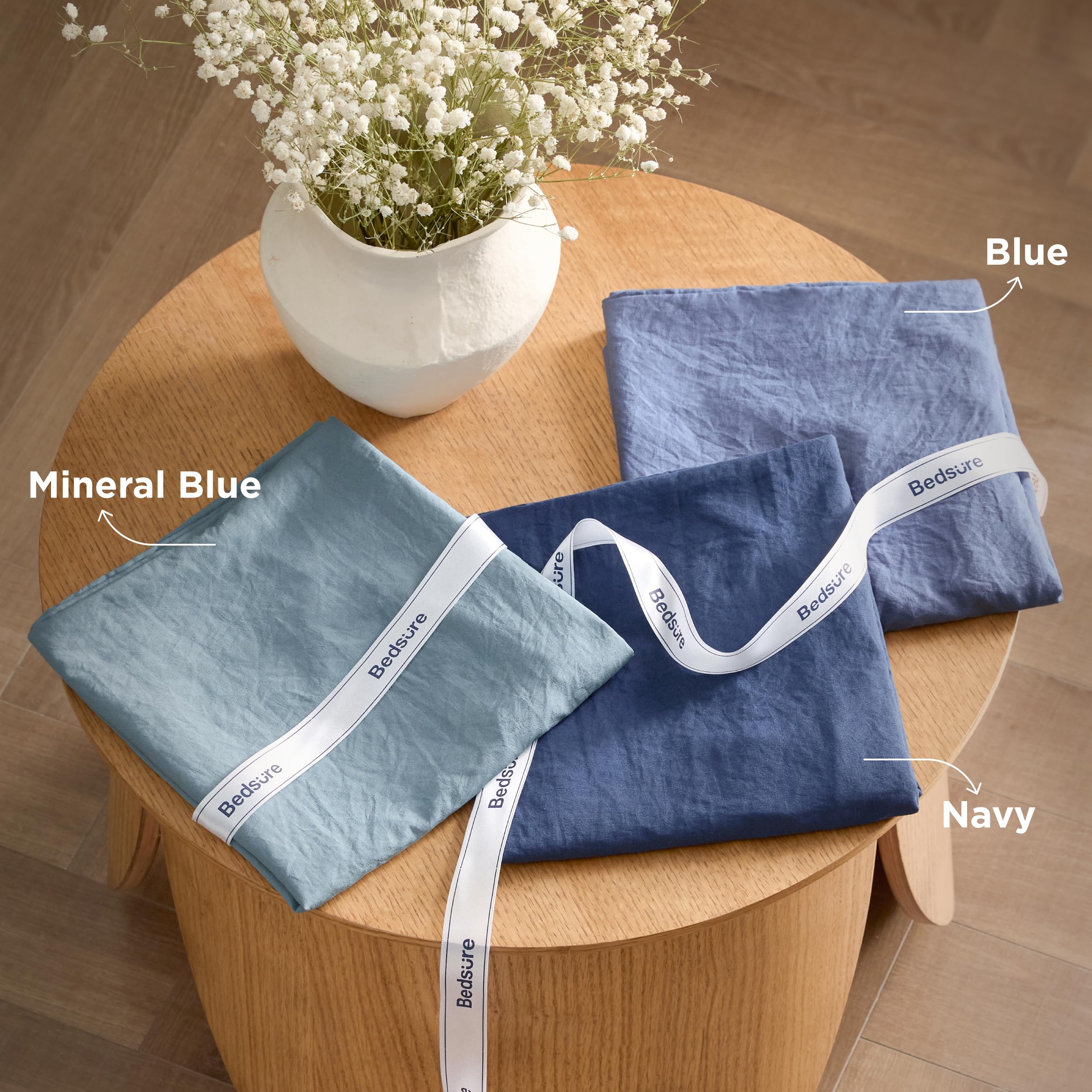 Bedsure comforter placed next to washing machine showing easy-care advantage: machine washable