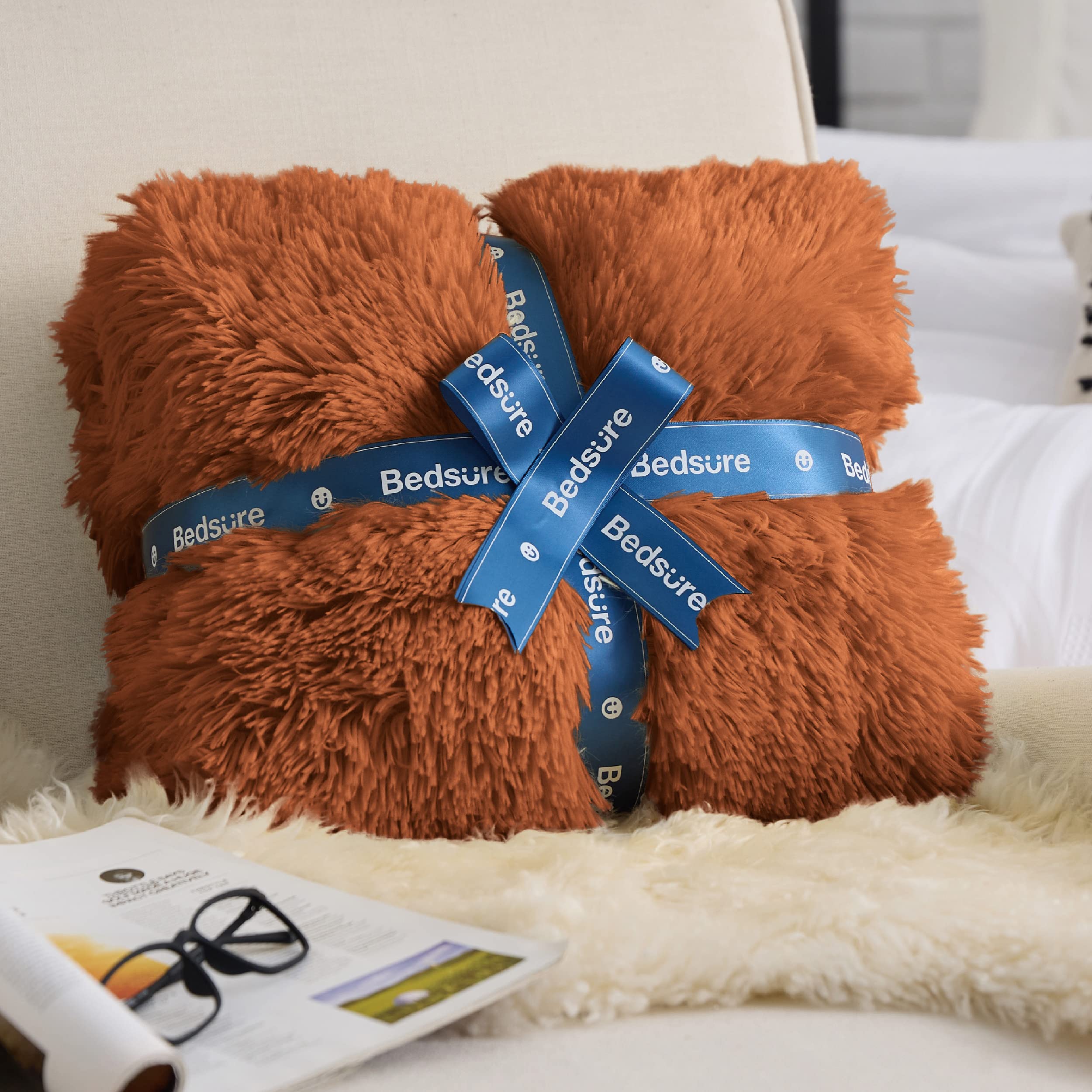 Bedsure blanket draped over sofa in living room for inviting comfort
