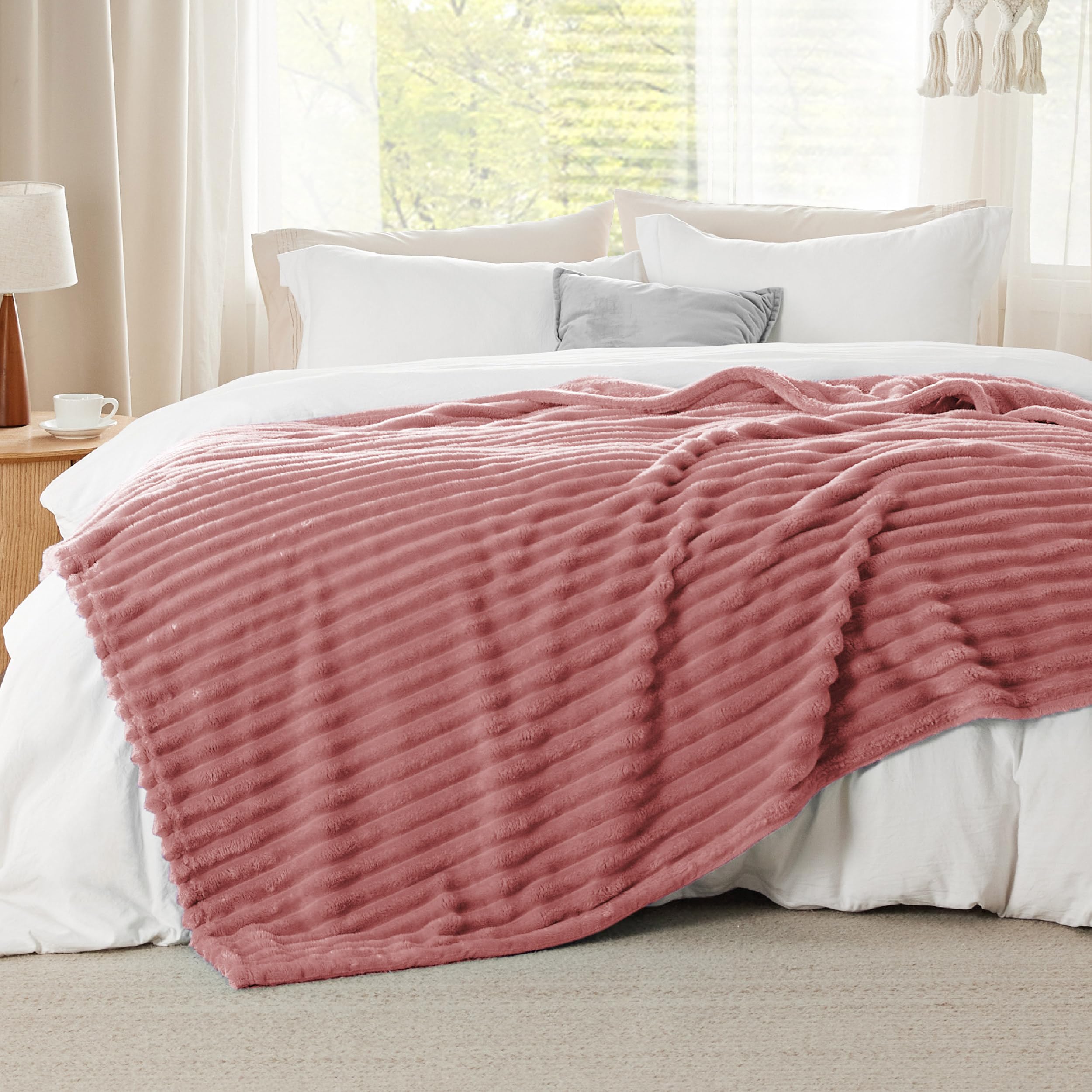 Bedsure dusty pink spread on queen bed for full coverage and layered look