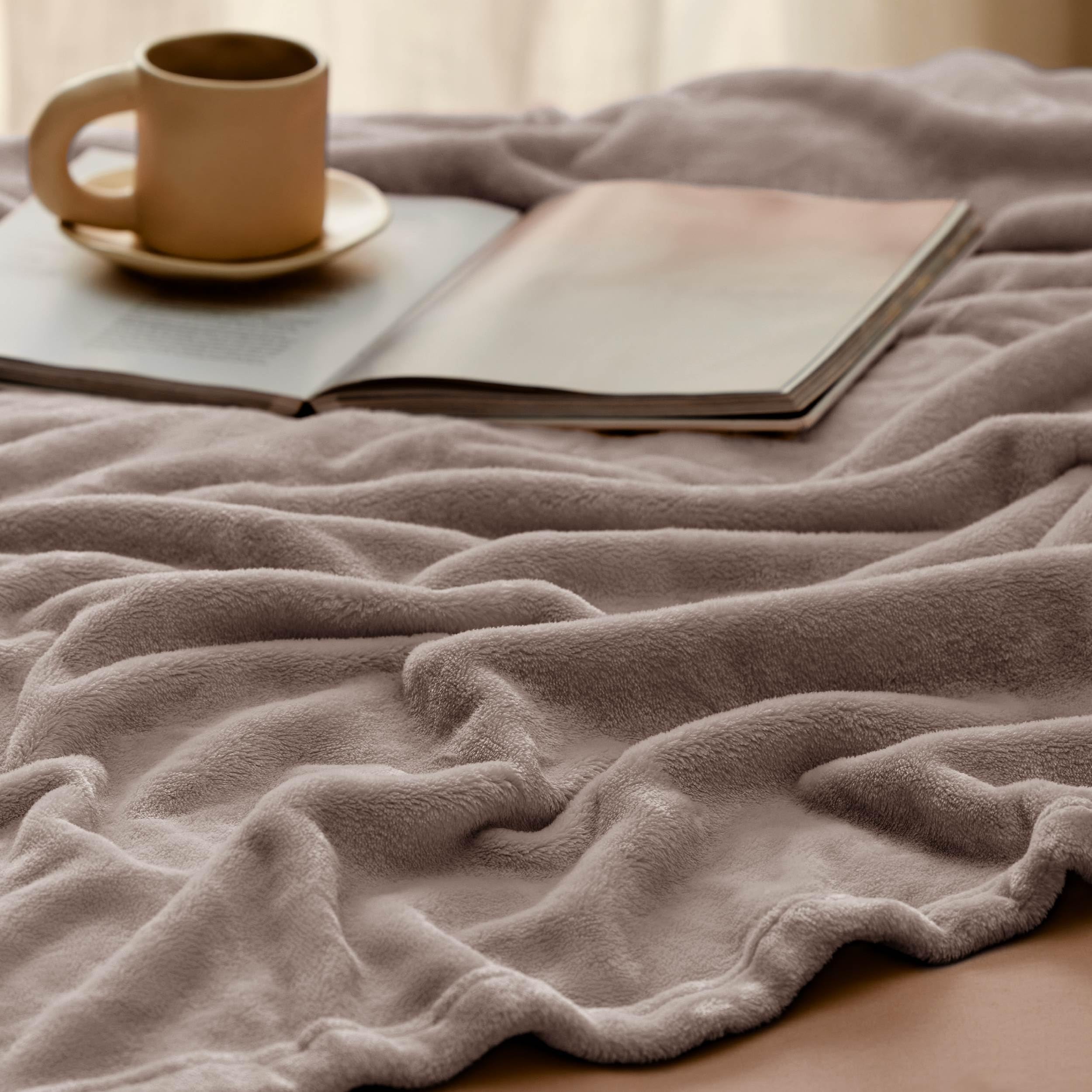 Bedsure GentleSoft on a couch in use conveying comfortable lounging benefit
