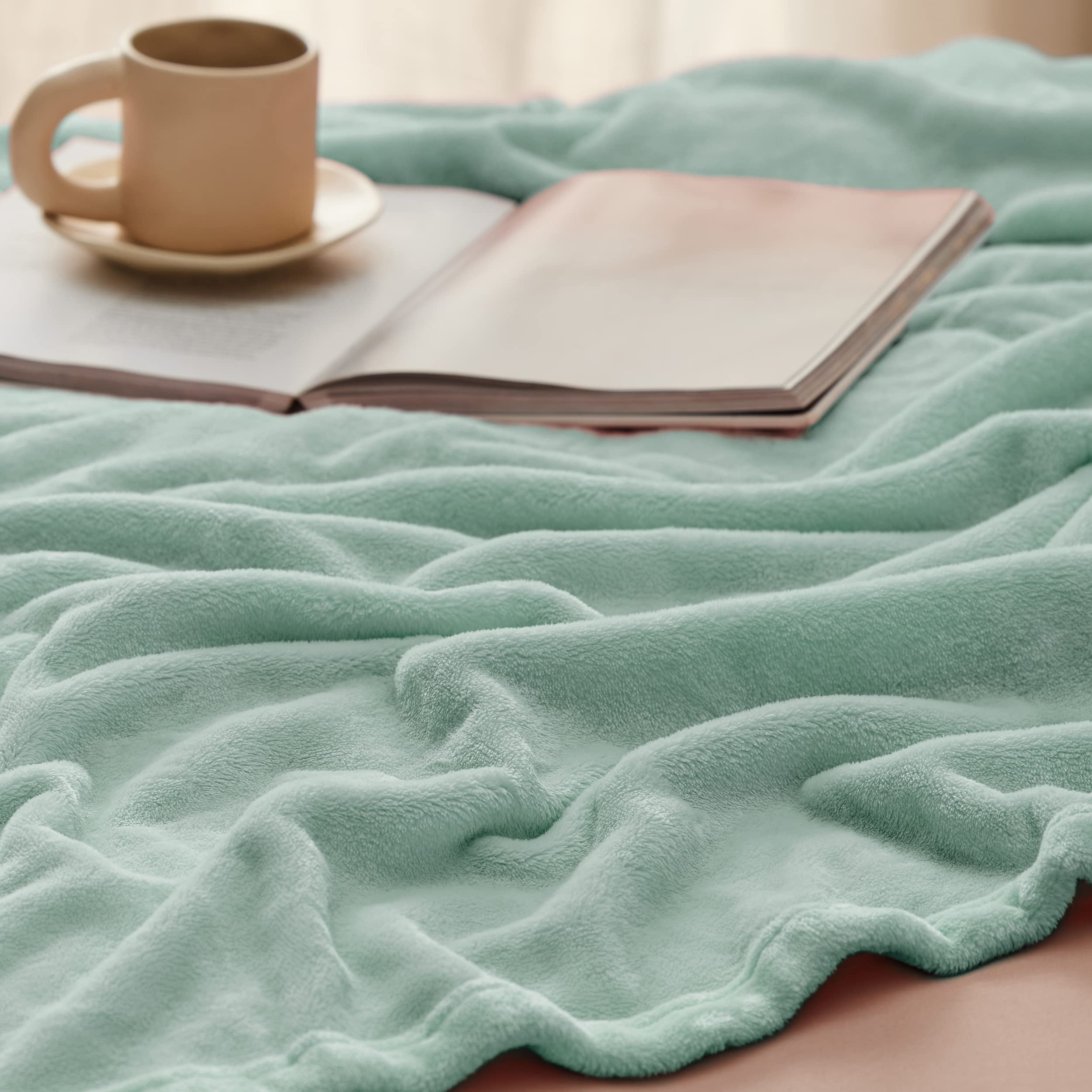 Bedsure GentleSoft folded blanket demonstrating queen-size thickness and compactness