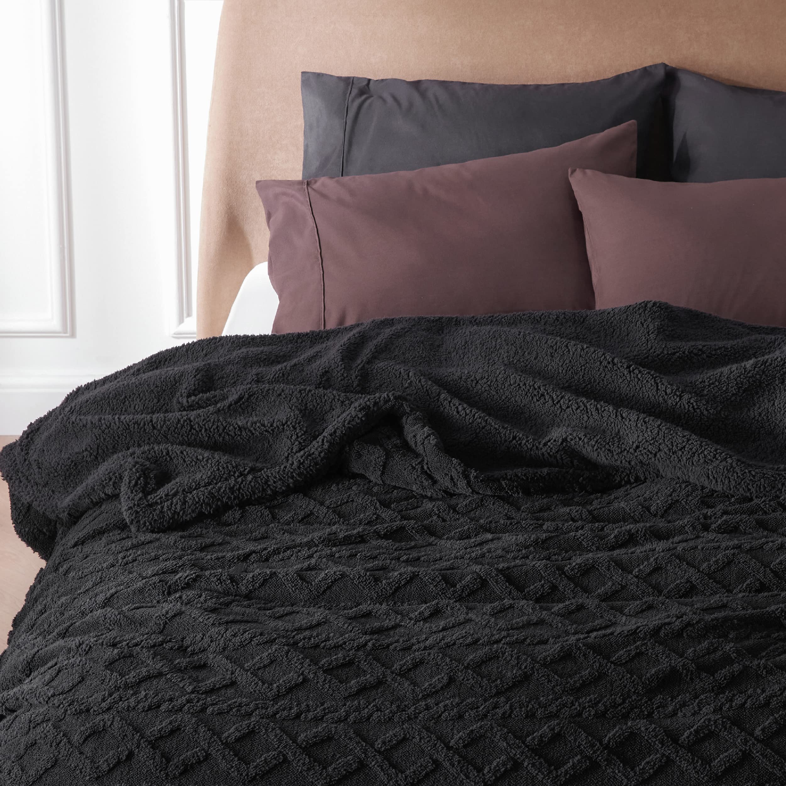 Bedsure blanket on lap demonstrating portable warmth for reading or travel