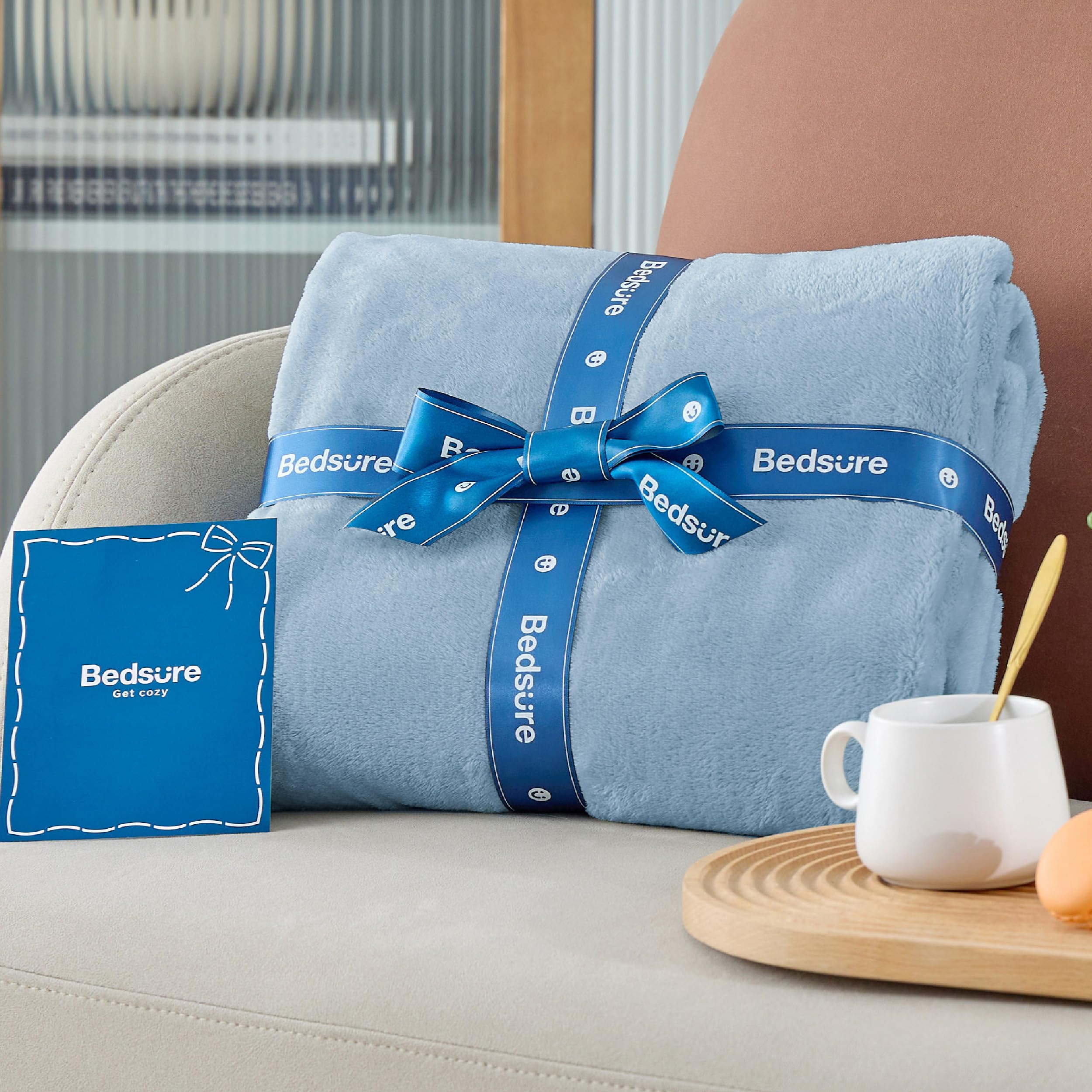 Bedsure GentleSoft rolled in suitcase illustrating travel-friendly benefit
