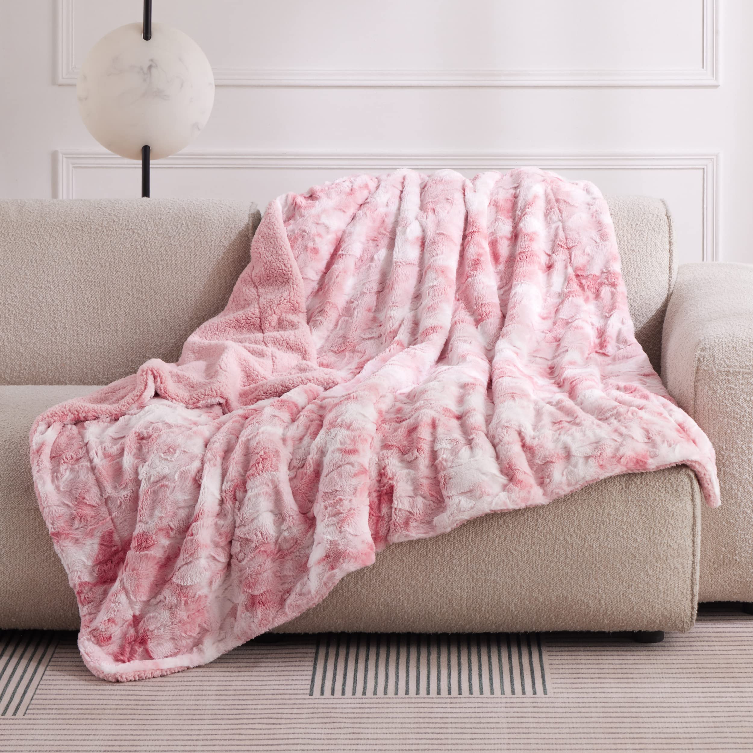 Bedsure blanket beside book showing twin size scale and versatility