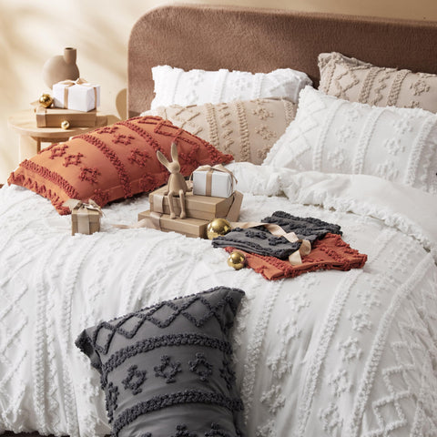 Bedsure hands pressing the comforter surface to show softness and gentle loft
